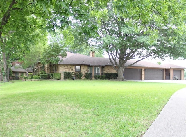 ranch-style house with a front lawn and a garage