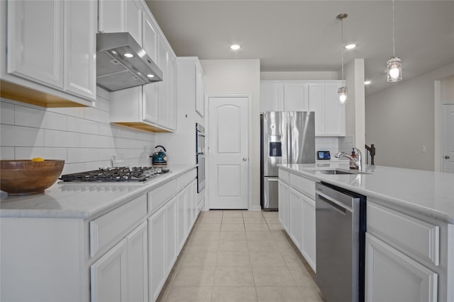 kitchen featuring white cabinets, appliances with stainless steel finishes, ventilation hood, and sink