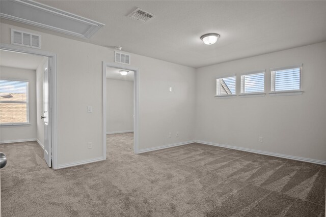 living room with a raised ceiling, a tiled fireplace, ceiling fan, and light tile patterned flooring