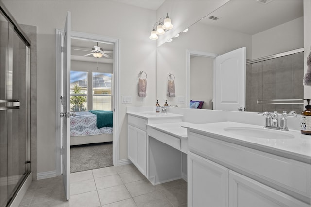 bathroom featuring tile patterned floors, vanity, ceiling fan, and an enclosed shower