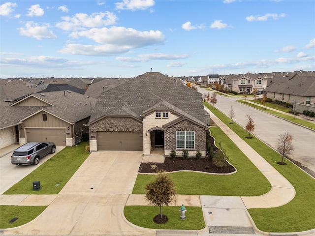 view of front facade with a garage and a front yard