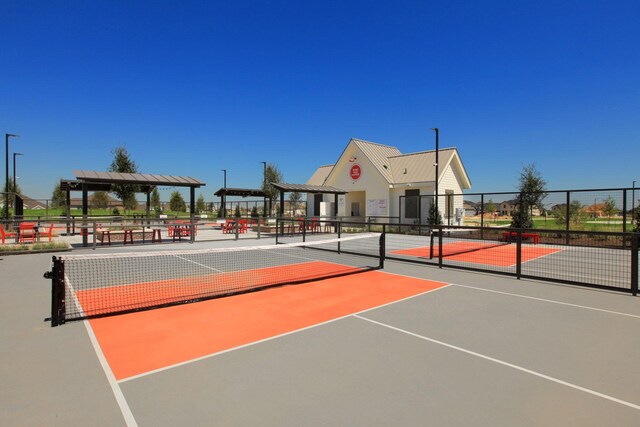 view of basketball court featuring tennis court