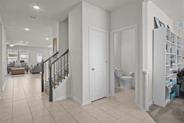 hallway with light tile patterned floors