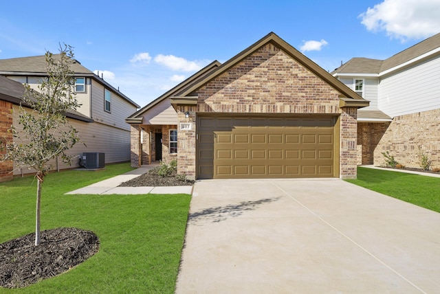 view of front of house featuring central AC unit, an attached garage, a front yard, brick siding, and driveway