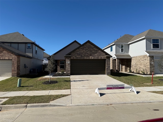 view of front of house featuring a front lawn and central AC unit