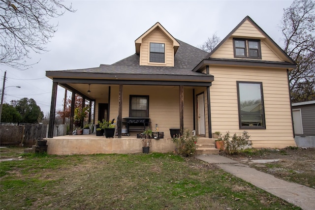 view of front facade featuring a porch and a front yard