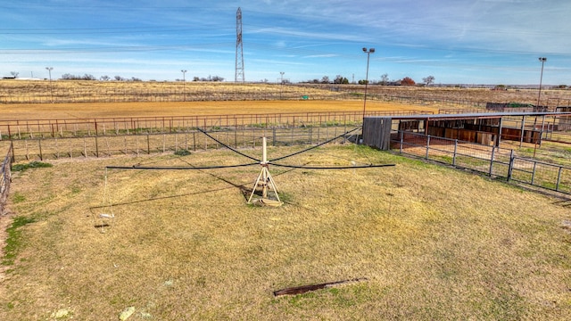 view of yard featuring an outbuilding and a rural view