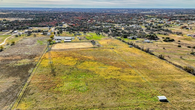 birds eye view of property with a rural view