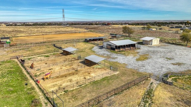 birds eye view of property with a rural view