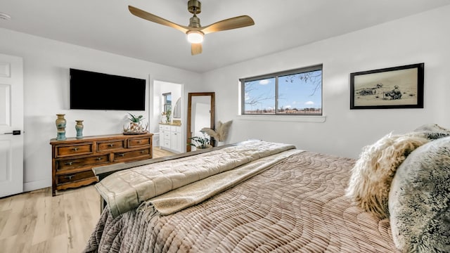 bedroom with ensuite bath, ceiling fan, and light hardwood / wood-style floors