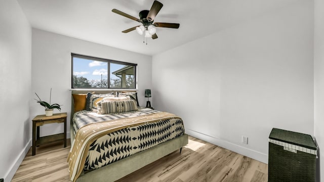 bedroom featuring ceiling fan and light hardwood / wood-style floors