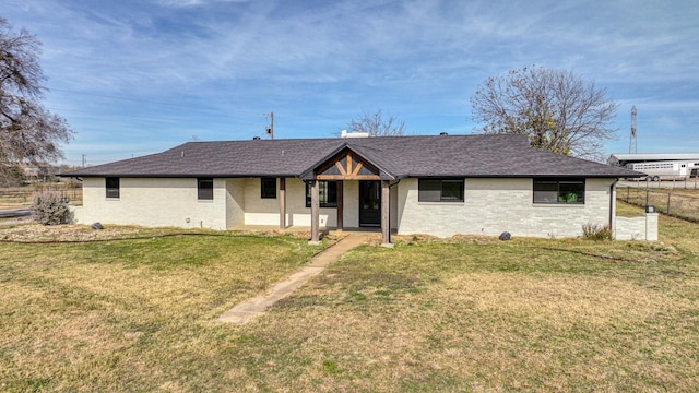 ranch-style home with a front lawn