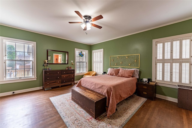 bedroom with multiple windows, hardwood / wood-style flooring, and ornamental molding