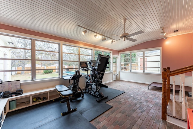 exercise room featuring plenty of natural light, lofted ceiling, ceiling fan, and wood ceiling