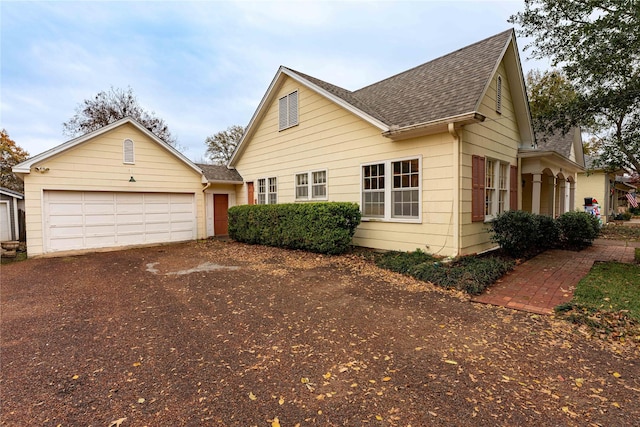 bungalow featuring a garage