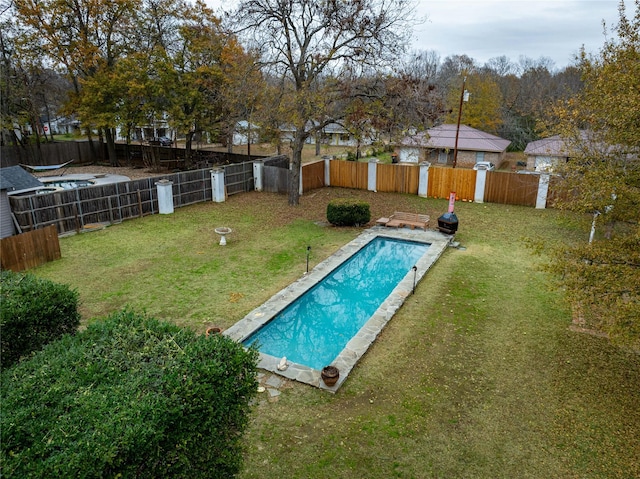 view of pool featuring a yard