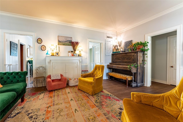 living area with ornamental molding and dark hardwood / wood-style floors