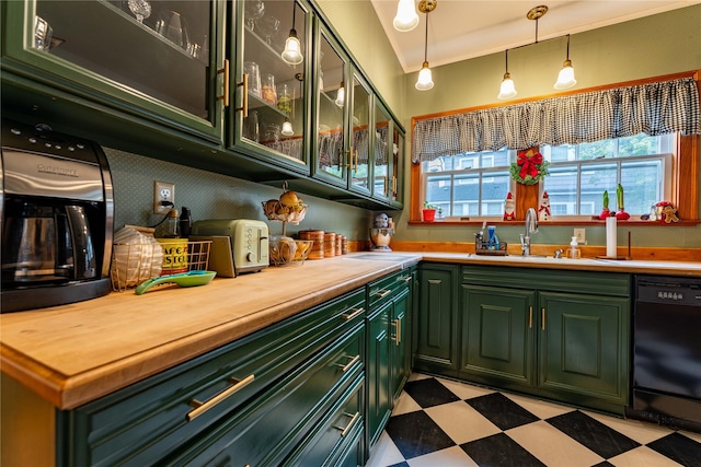 bar featuring hanging light fixtures, dishwasher, sink, and green cabinetry