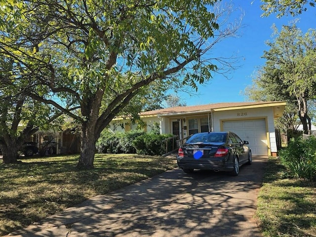 ranch-style house featuring a garage