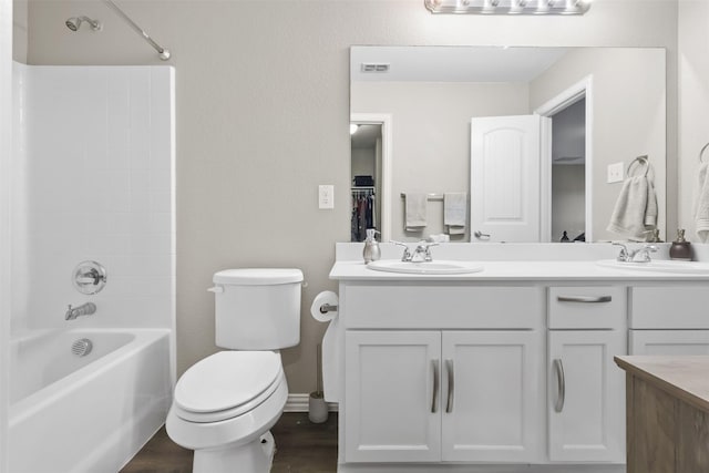 full bathroom featuring vanity, toilet, shower / tub combination, and wood-type flooring