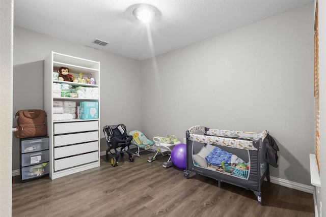 bedroom with hardwood / wood-style floors