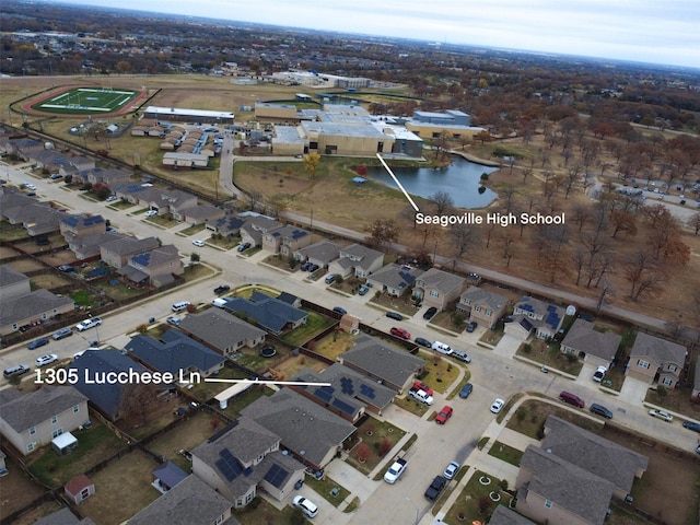 bird's eye view featuring a residential view and a water view