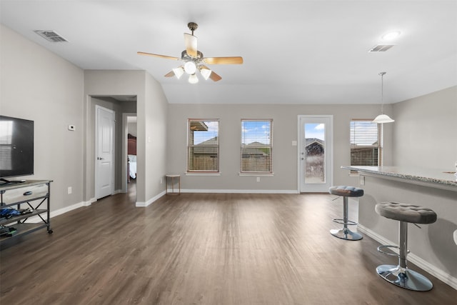 living room with dark hardwood / wood-style flooring, plenty of natural light, lofted ceiling, and ceiling fan