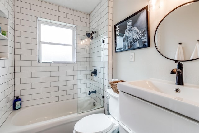 full bathroom with vanity, toilet, and tiled shower / bath