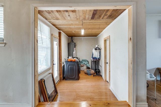 hallway with a wealth of natural light, water heater, wooden ceiling, and light wood-type flooring