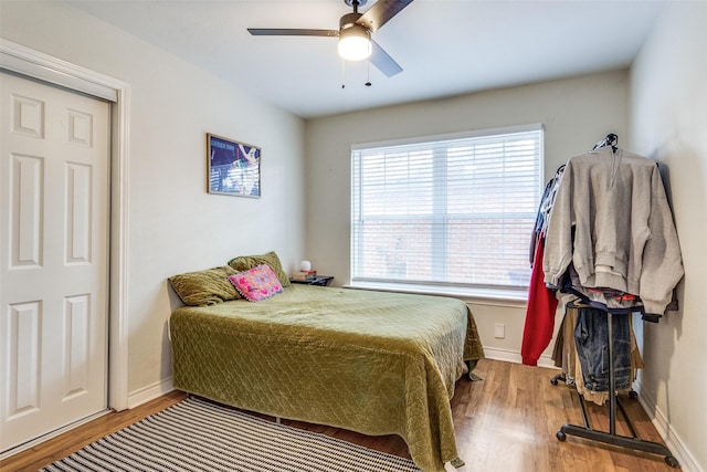 bedroom featuring ceiling fan and hardwood / wood-style flooring