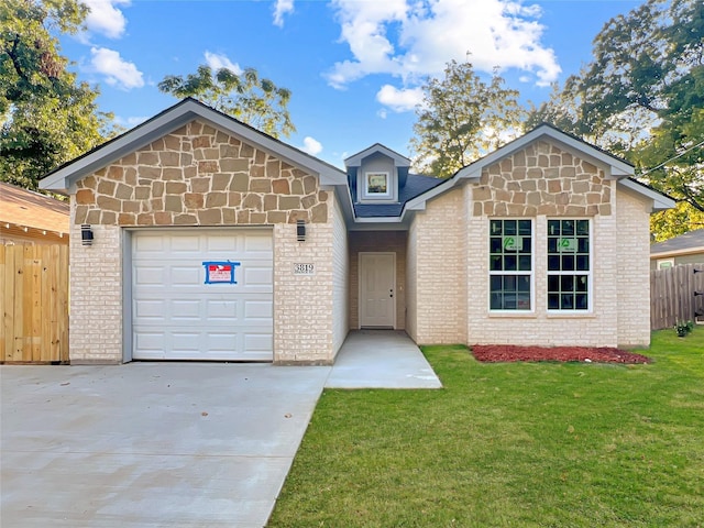 view of front of house with a front lawn and a garage