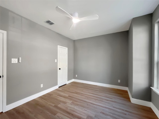 unfurnished room featuring ceiling fan and light wood-type flooring