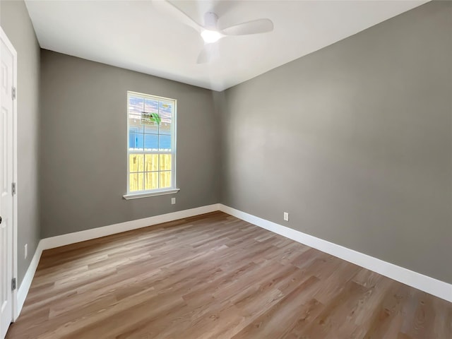 empty room featuring light hardwood / wood-style flooring and ceiling fan