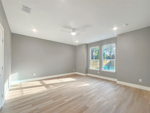 unfurnished room with light hardwood / wood-style flooring and ceiling fan