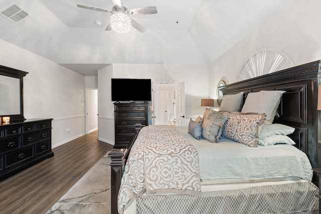 bedroom featuring dark wood-type flooring, ceiling fan, and vaulted ceiling