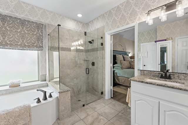 bathroom with vanity, tile patterned floors, and shower with separate bathtub