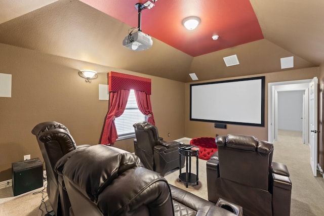 carpeted cinema room featuring lofted ceiling