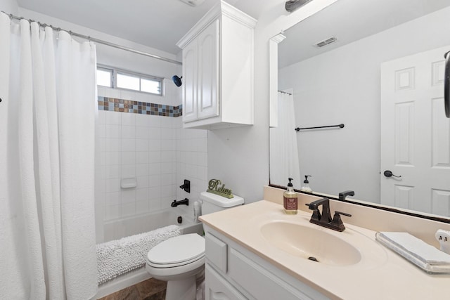 full bathroom with vanity, shower / tub combo with curtain, and toilet