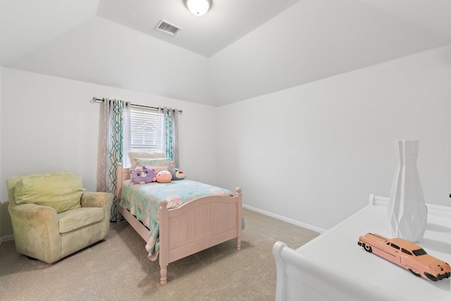 carpeted bedroom with vaulted ceiling