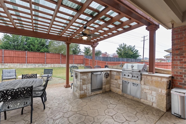 view of patio / terrace featuring an outdoor kitchen, area for grilling, ceiling fan, and a pergola