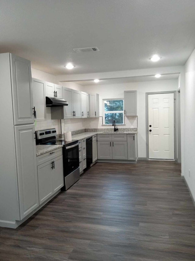 kitchen with sink, dishwasher, dark hardwood / wood-style floors, stainless steel electric range oven, and decorative backsplash