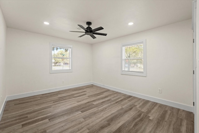 spare room featuring ceiling fan and wood-type flooring