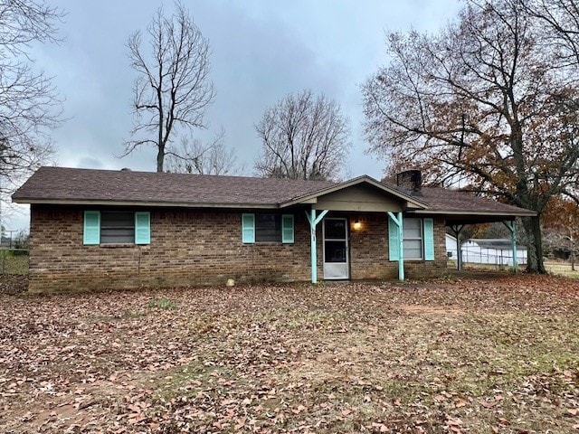 single story home with a carport