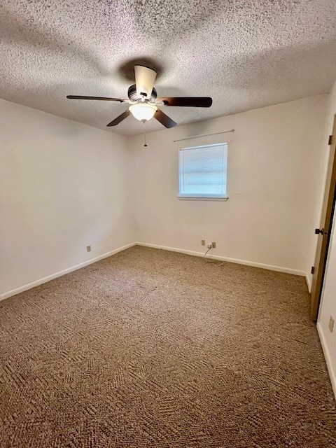 interior space with ceiling fan, carpet floors, and a textured ceiling