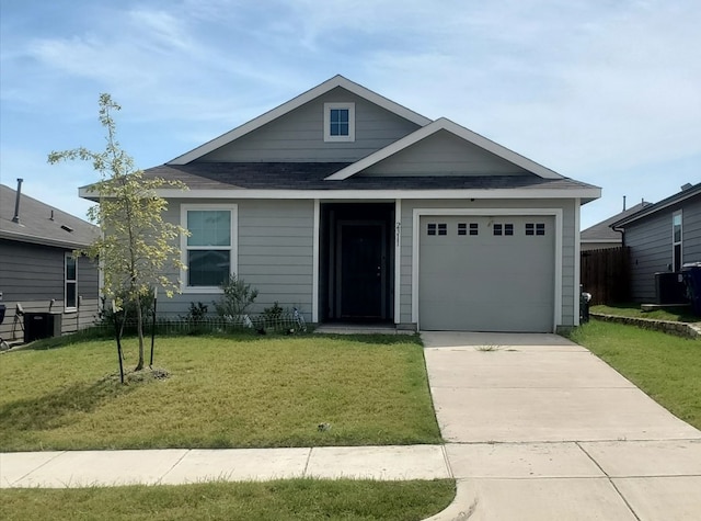 view of front of house with a front lawn and a garage