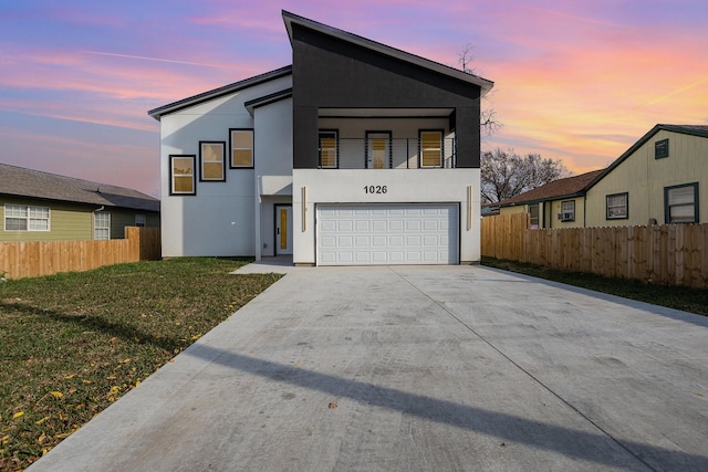 contemporary house with a garage and a lawn