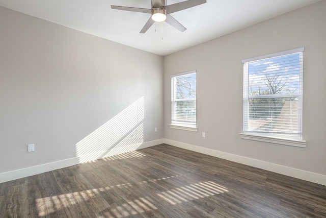 spare room featuring ceiling fan and dark hardwood / wood-style flooring