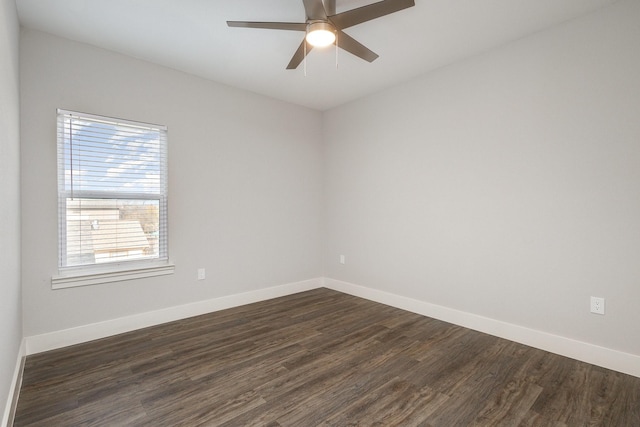 spare room with ceiling fan and dark hardwood / wood-style flooring