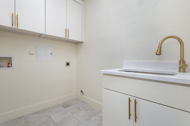 washroom with sink, cabinets, hookup for a gas dryer, hookup for a washing machine, and electric dryer hookup