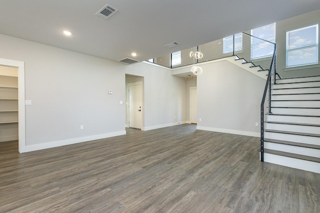 unfurnished living room featuring dark hardwood / wood-style flooring